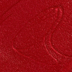 Close-up colour texture swatch of Sally Hansen Miracle Gel Supercharged Bold Glam in XOXO Sally 460, a radiant red pearl finish