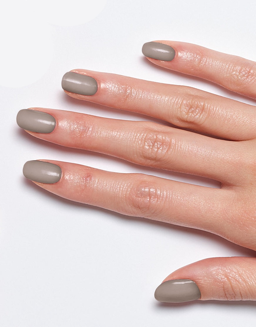 Models' hand showcasing Sally Hansen Miracle Gel Supercharged Bold Glam in Steel The Scene 197, a cool neutral creme nail colour