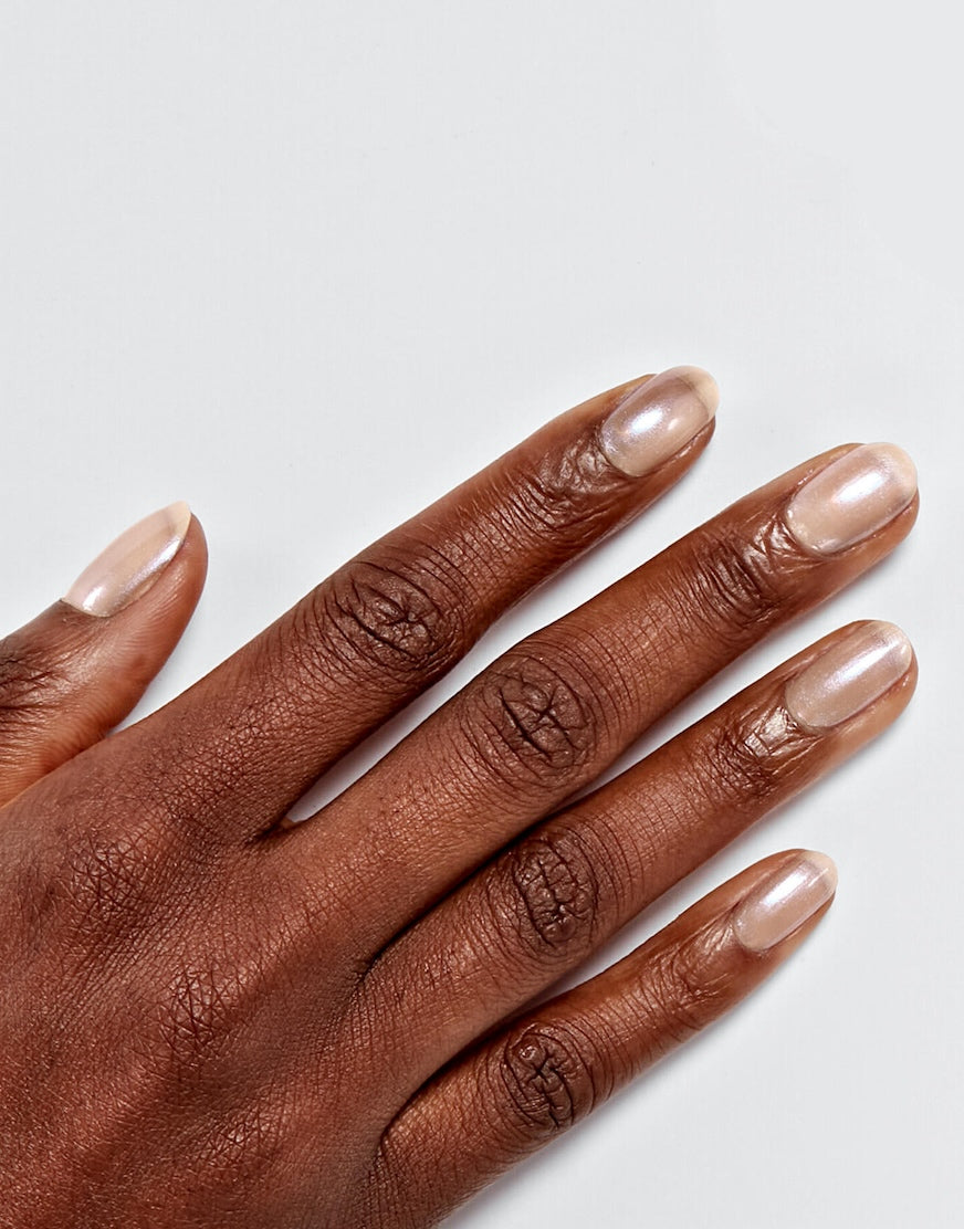 Models' hand showcasing Sally Hansen Miracle Gel Supercharged Bold Glam in Chic's In Charge 231, a sheer pink pearl nail colour