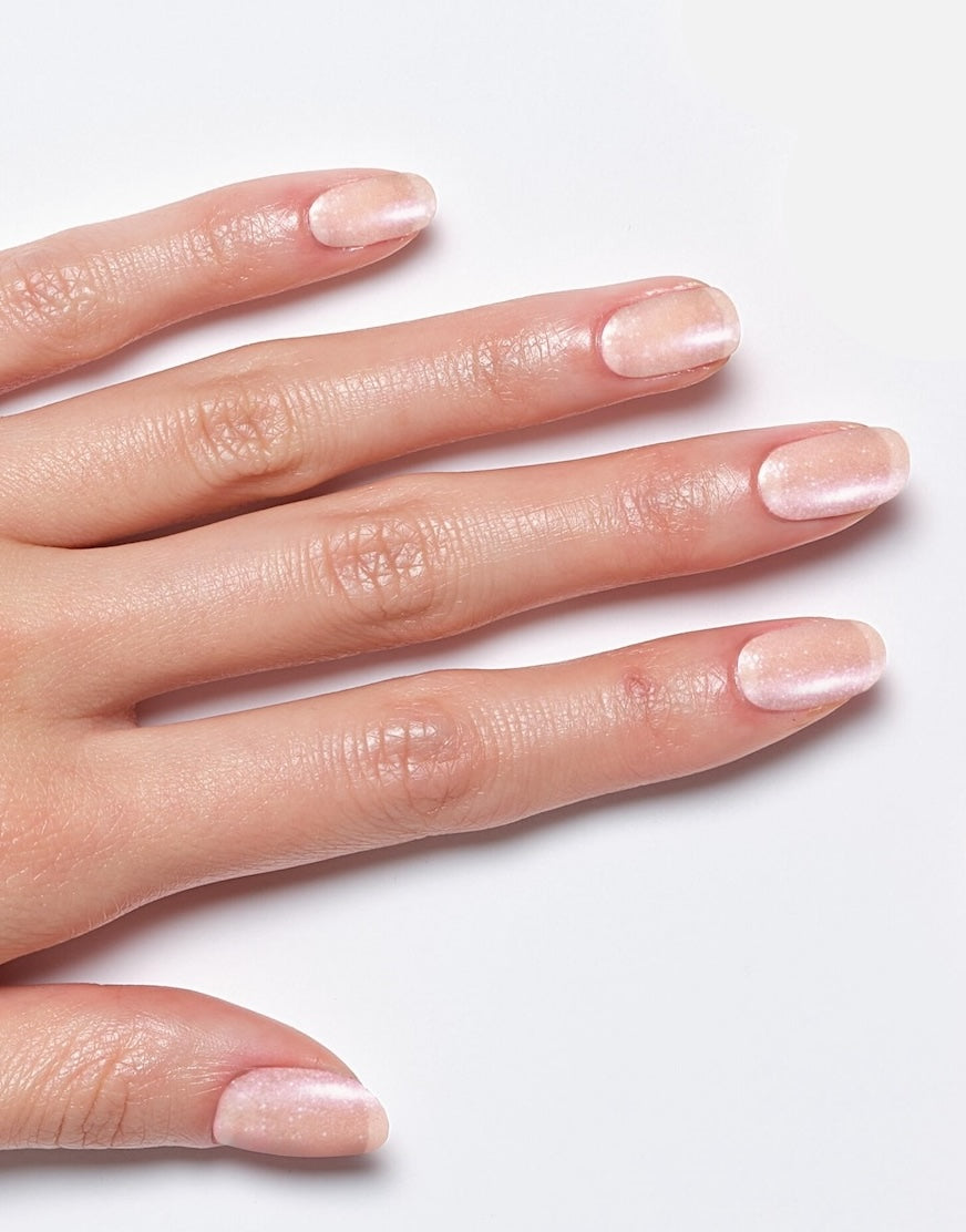 Model's hand showcasing Sally Hansen Miracle Gel Supercharged Bold Glam in Show Stop-Pearl 239, a soft pearlescent light pink nail colour