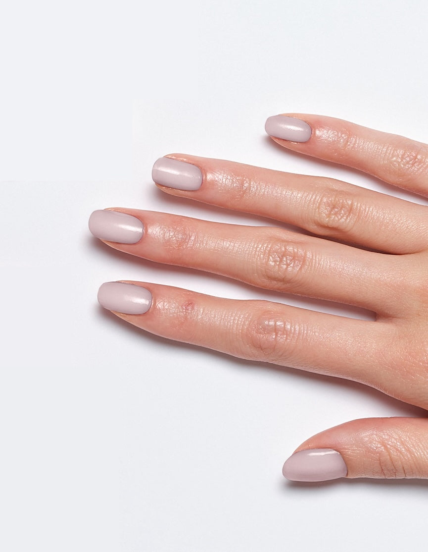 Models' hand showcasing Sally Hansen Miracle Gel Supercharged Bold Glam in Pursue Your Dreams 585, a smooth orchid creme nail colour