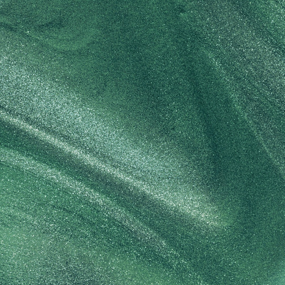 Close-up colour texture swatch of Sally Hansen Miracle Gel Supercharged Bold Glam in Rocket Fuel 735, a fresh green pearl finish