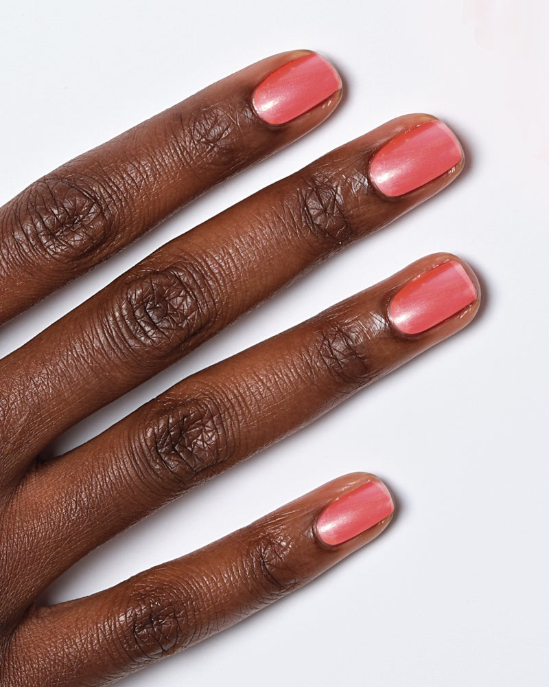 Model's hand showing nails painted in Miracle Gel Supercharged Pinks shade Berry Best Effort.