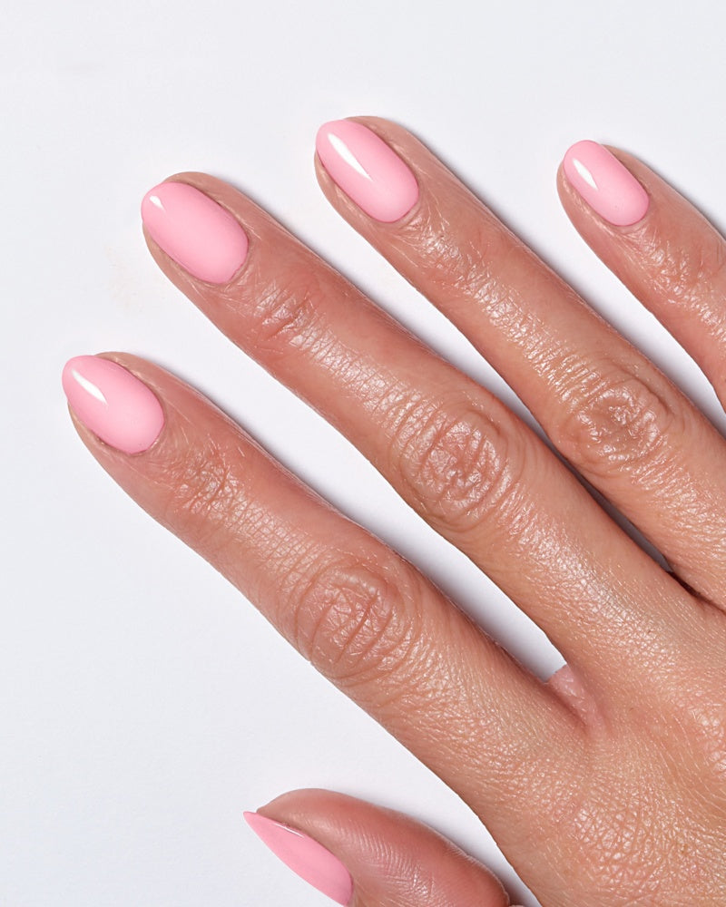 Model's hand showing nails painted in light pink polish from the Miracle Gel Supercharged Pinks collection.