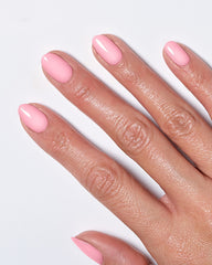 Model's hand showing nails painted in light pink polish from the Miracle Gel Supercharged Pinks collection.